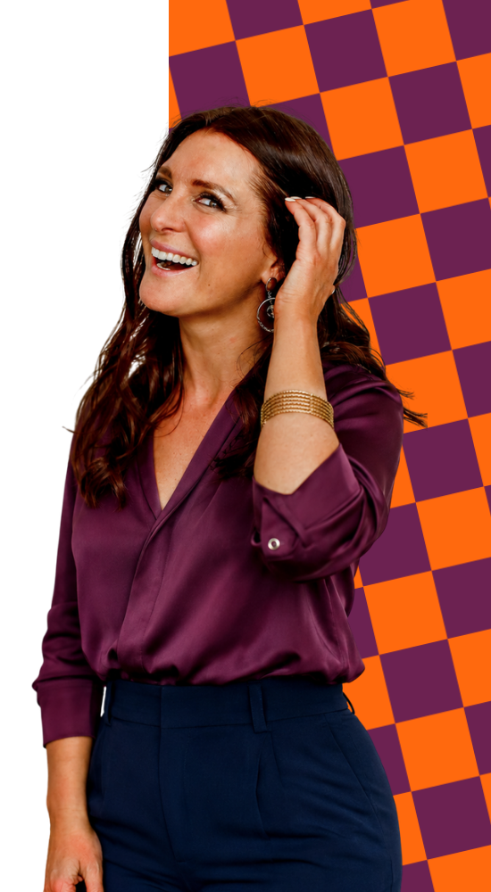 Jeanette Craig, laughing, hand in her hair, against a plum and orange checkerboard